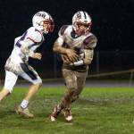 KODY CHRISTEN / THE CHRONICLE 
Pe Ell-Willapa Valley running back Lucas Lusk (right) runs the ball during a game on Oct. 31. The Titans travel north to face Friday Harbor in a 2B State first-round playoff game on Saturday.