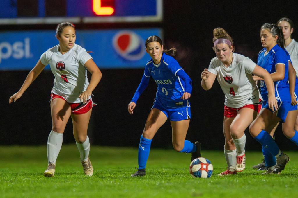 PHOTO BY FOREST WORGUM Elma midfielder Zippy Valentine (0) competes for possession against Columbia (White Salmon) players Kiera Bucher (left) and Willow Cohen during a 1A District 4 Tournament game on Tuesday at Davis Field in Elma.