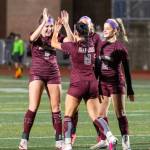 PHOTO BY SHAWN DONNELLY Montesanos Sam Roundtree (left) congratulates teammate Adda Potts (8) after a goal in the first half of a 4-1 win over La Center on Tuesday at Jack Rottle Field in Montesano.