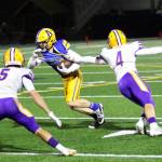 RYAN SPARKS | THE DAILY WORLD Aberdeen receiver Sam Schreiber (middle) tries to avoid the tackle of Columbia Rivers Hunter Vynanek (4) during the Bobcats 7-6 loss in a 2A State play-in matchup on Tuesday at Stewart Field in Aberdeen.