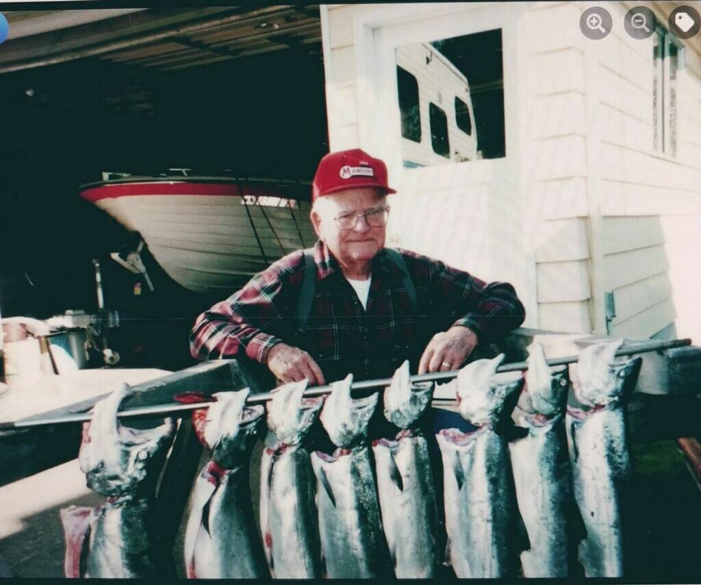 Howard took many a trip to Seiku. He holds up a fine stringer of salmon.