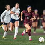 PHOTO BY FOREST WORGUM Montesano forward Adda Potts sprints away from Kings Way Christians Anna Osborne (15) and Amylia Akers during the Bulldogs 3-1 win in a 1A District 4 semifinal game on Thursday in Montesano.