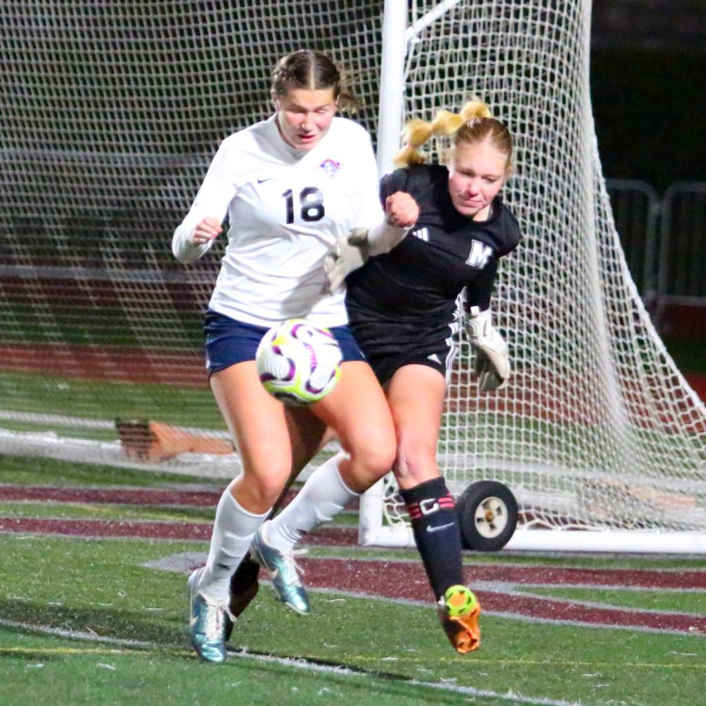 RYAN SPARKS | THE DAILY WORLD
Motnesano goal keeper Izzie Taylor (right) collides with King's Way Christian's Addison Bagley during the Bulldogs' 3-1 win in a 1A District 4 semifinal game on Thursday in Montesano.