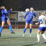 RYAN SPARKS | THE DAILY WORLD Elma defenders Chloe Donais (left) and Amaya Lewis (13) prevent the ball from getting through in a 2-0 win over Rochester in a 1A District 4 Tournament elimination game on Saturday in Montesano. The Eagles earned a berth in the state tournament with the victory.