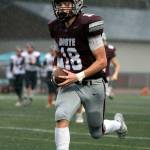 PHOTO BY FOREST WORGUM Montesano senior Mason Rasmussen returns a blocked field goal for a touchdown at the end of the first half in the Bulldogs 31-7 win over Omak in a 1A State Tournament playoff game on Saturday at Jack Rottle Field in Montesano.