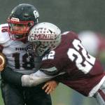 PHOTO BY FOREST WORGUM Montesano defender Ashton McKinney (22) lays a hit on Omak tight end Payton Smith during the Bulldogs 31-7 win in a 1A State Tournament playoff game on Saturday at Montesano High School.