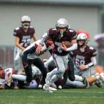 PHOTO BY FOREST WORGUM 
Montesanos Zach Timmons (4) looks for running room during a 31-7 win over Omak on Saturday. The Bulldogs face No. 3 La Center on Saturday at Woodland High School.