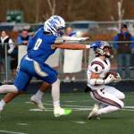 RYAN SPARKS | THE DAILY WORLD Montesanos Zach Timmons (4) catches a pass downfield during a 21-10 win over La Center in a 1A State Football quarterfinal game on Saturday at Woodland High School.
