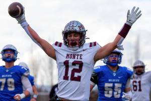 PHOTO BY FOREST WORGUM Montesanos Toren Crites raises his arms after scoring a touchdown during a 21-10 win over La Center in a 1A State Football quarterfinal game on Saturday at Woodland High School.