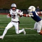 RYAN SPARKS | THE DAILY WORLD Montesano senior Toren Crites (12) carries the ball against Seton Catholics Jacob Williams during the Bulldogs 35-14 loss in a 1A State semifinal game on Saturday at Evergreen High School in Vancouver.