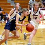 RYAN SPARKS | THE DAILY WORLD Aberdeen point guard Sophie Knutson (left) dribbles while being defended by Montesanos Tieander Olson (12) and Josie Forster during the Bulldogs 42-21 win on Tuesday in Montesano.
