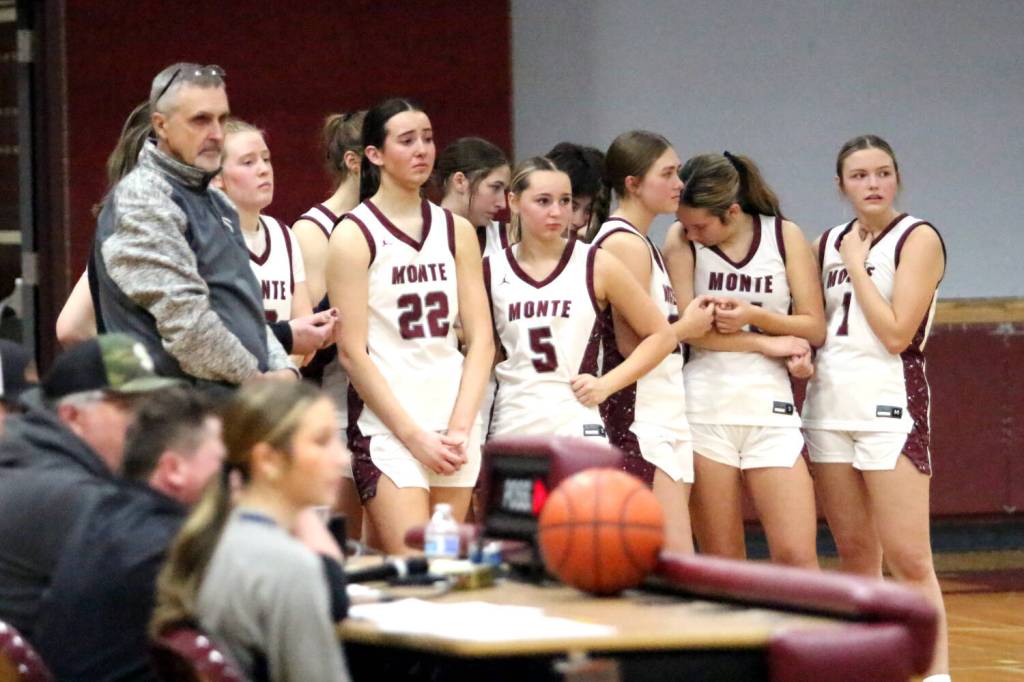 RYAN SPARKS | THE DAILY WORLD Ava Schrader (22) and the Montesano Bulldogs look on as teammate Ali Parkin is placed on a stretcher after suffering an injury in a 42-21 win over Aberdeen on Thursday at Montesano High School.