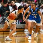 PHOTO BY FOREST WORGUM Raymond-South Bends Megan Kongbouakhay (left) dribbles against Elmas Nency Guzman in the Ravens 56-27 win on Thursday in Raymond.