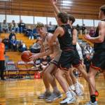 PHOTO BY FOREST WORGUM Montesanos Caden Grubb (left) scored 10 points in the Bulldogs 51-27 loss to Rainier on Monday at Montesano High School.
