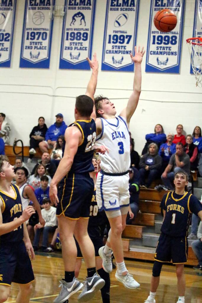 RYAN SPARKS | THE DAILY WORLD
Elma's Isaac McGaffey (3) puts up a shot during a 67-48 loss to Forks on Friday at Elma High School.