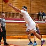 PHOTO BY FOREST WORGUM Hoquiams Ryan Pullar leaps in an attempt to save a loose ball during a 62-39 loss to Forks on Monday at Hoquiam High School.