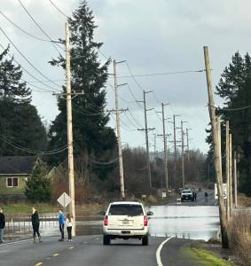 Tasha Hoxit
Water flows over the roadway Wednesday between Satsop and Brady.