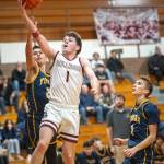 PHOTO BY FOREST WORGUM Montesanos Colton Grubb (1) drives to the hoop during a 58-51 loss to Forks on Friday at Montesano High School.