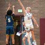 PHOTO BY FOREST WORGUM Montesanos Mason Fry (22) gets his fingers on a shot by Forks Bubba Hernandez-Stansbury during the Bulldogs 58-51 loss on Friday at Montesano High School.