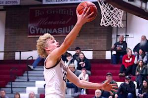 PHOTO BY HAILEY BLANCAS Montesanos Mason Fry drives to the hoop during the Bulldogs 58-51 loss to Forks on Friday in Montesano.