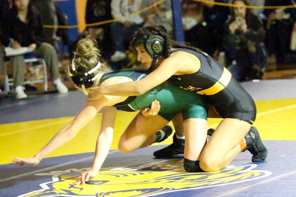 RYAN SPARKS | THE DAILY WORLD
North Beach senior Mayra Strandberg (right) gains control of Port Angeles' Lilly Lancaster during the 115-pound title match at the Grays Harbor Championships on Saturday at Aberdeen High School.