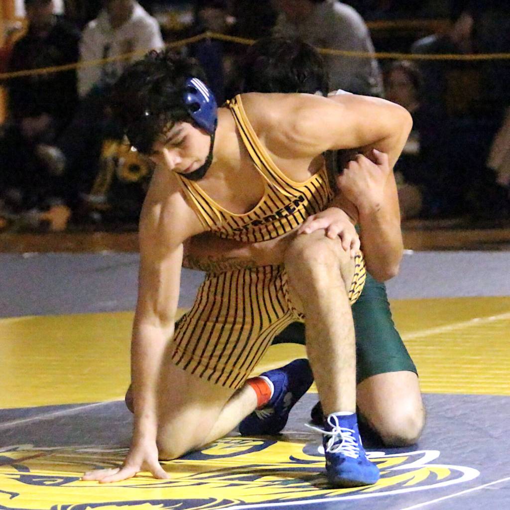RYAN SPARKS | THE DAILY WORLD Aberdeens Erick Silveira escapes the grasp of Port Angeles Oliver Martinez in the 175-pound title match at the Grays Harbor Championships on Saturday at Aberdeen High School.