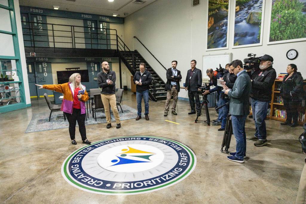 Media from across Washington state listen to Allison Krutsinger talk about the plans for relocating juvenile inmates from Green Hill School to Stafford Creek Corrections Center in Aberdeen on Wednesday, Dec. 18.