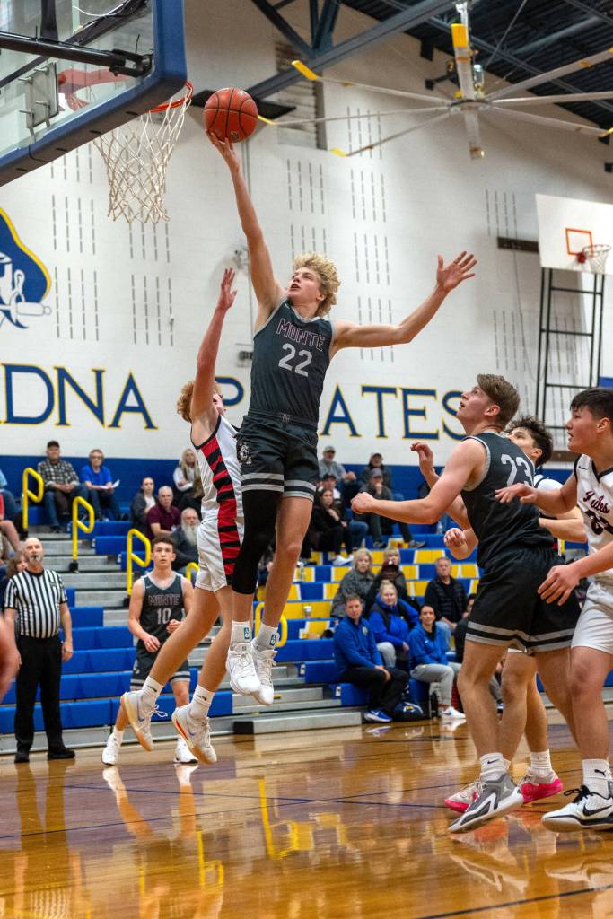 PHOTO BY FOREST WORGUM Montesanos Mason Fry (22) lays the ball up during a 65-55 win over Wahkiakum on Saturday at Adna High School.