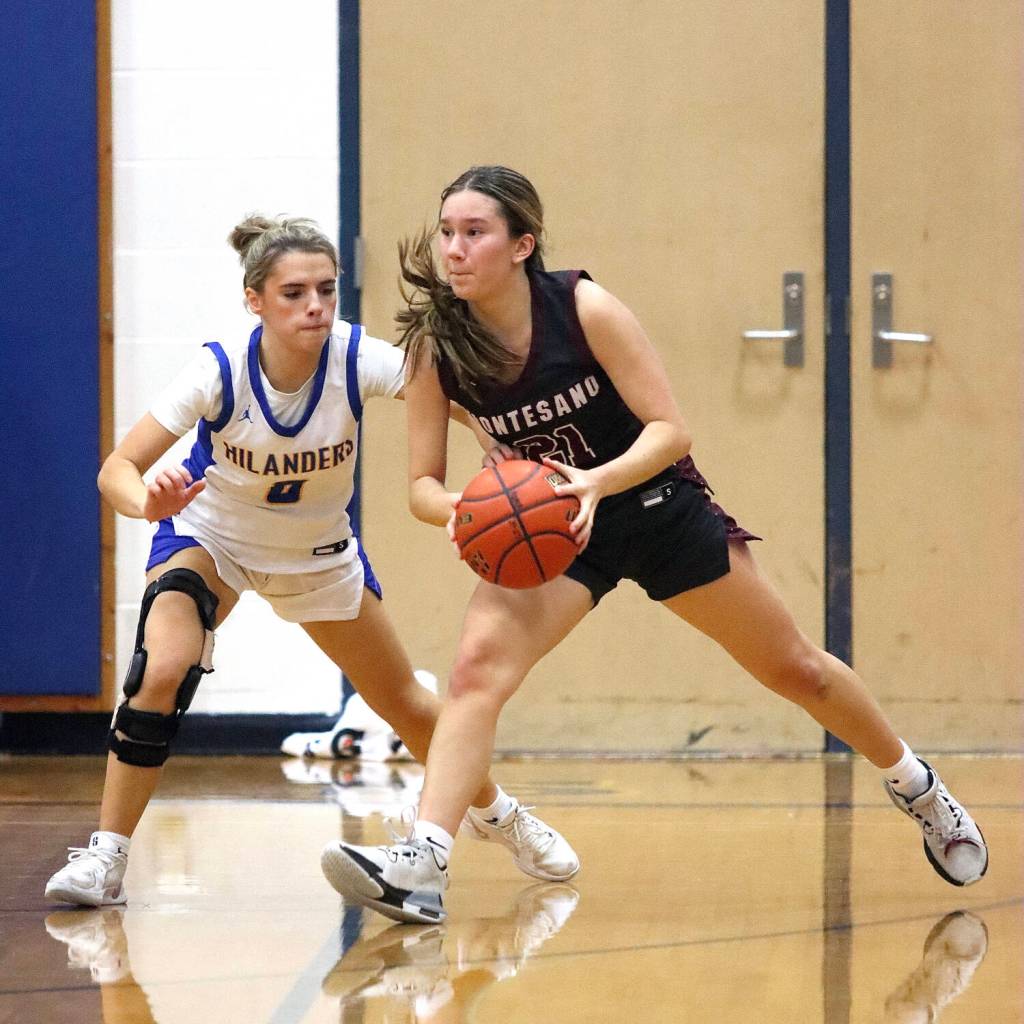 PHOTO BY HAILEY BLANCAS Montesanos Makena Blancas (right) looks to pass against Kelsos Madalynn Moe during the Bulldogs 43-30 win at the Adna Holiday Tournament on Saturday at Adna High School.