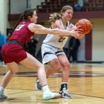 PHOTO BY FOREST WORGUM Raymond-South Bends Kassie Koski (right) is defended by Hoquiams Katlyn Brodhead during the Ravens 48-41 win in the Raymond New Years Tournament on Saturday in South Bend.
