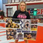 PHOTO BY FOREST WORGUM Aberdeens Felicia Bell became the first Bobcats girls wrestler to win 100 career matches with a victory in the 130-pound third-place match at the Grizzly Stocking Stuffer on Saturday in Hoquiam.