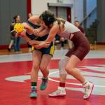 PHOTO BY FOREST WORGUM Aberdeens Paisley Floch (left) wrestles with Montesanos Kiara Whisenhunt during a 120-pound quarterfinal match at the Grizzly Stocking Stuffer on Saturday at Hoquiam High School.