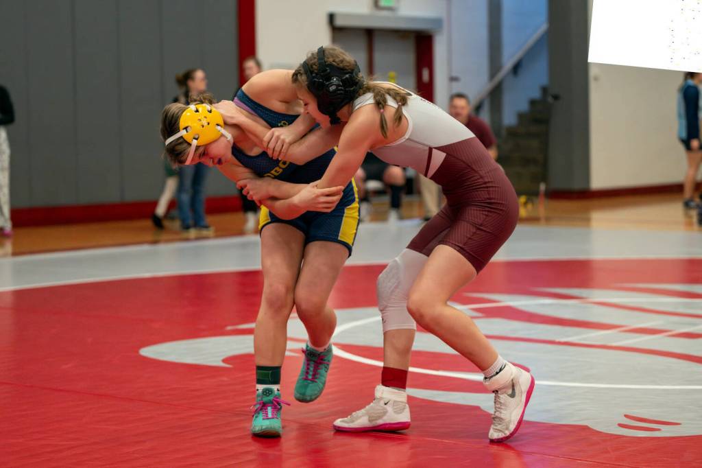 PHOTO BY FOREST WORGUM Aberdeens Paisley Floch (left) wrestles with Montesanos Kiara Whisenhunt during a 120-pound quarterfinal match at the Grizzly Stocking Stuffer on Saturday at Hoquiam High School.