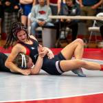 PHOTO BY FOREST WORGUM Hoquiams Emily Brodhead (right) gains control of North Thurstons Evelyn Talbot during a 120-pound match at the Grizzly Stocking Stuffer on Saturday at Hoquiam High School.