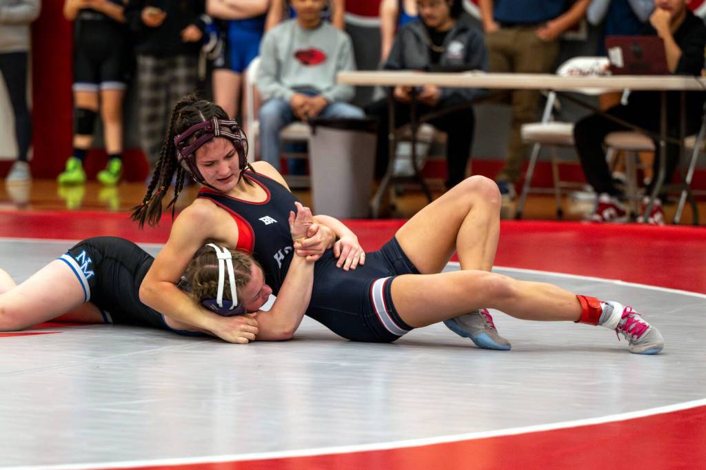 PHOTO BY FOREST WORGUM Hoquiams Emily Brodhead (right) gains control of North Thurstons Evelyn Talbot during a 120-pound match at the Grizzly Stocking Stuffer on Saturday at Hoquiam High School.