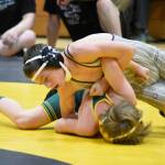 PHOTO BY SUE MICHALAK BUDSBERG Montesano freshman Finley Ekerson (top) works to pin Darringtons Kinden Tollenaar during the 106-pound final of The Rock Tournament on Saturday at Vashon Island.