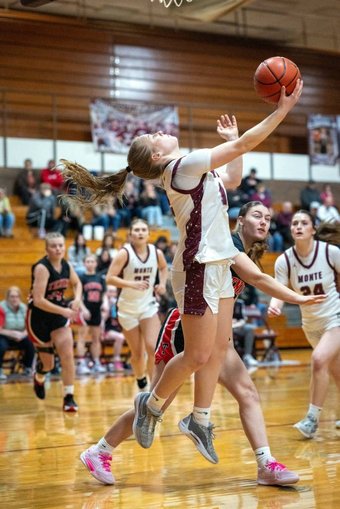 PHOTO BY FOREST WORGUM Montesano guard Tieander Olson attempts a reverse lay-up during a 62-22 win over Tenino on Thursday at Montesano High School.