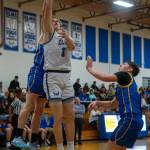 PHOTO BY FOREST WORGUM Elmas Isaac McGaffey (3) puts up a shot during a 62-29 victory over Rochester on Friday at Elma High School. McGaffey had a double-double with 13 points and 11 rebounds in the game.