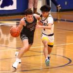 PHOTO BY HAILEY BLANCAS Montesanos Terek Gunter (10) jostles with Aberdeens Xanto Raya during the Bulldogs 67-59 win on Saturday in Aberdeen.