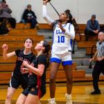 PHOTO BY MIKE ROBERTS Elmas Keke Bol (10) puts up a one-handed shot during a 56-43 loss to Kalama on Saturday in Elma.