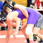PHOTO BY SUE MICHALAK BUDSBERG Elmas Xavier Espinosa (top) controls Onalaskas Benito Escalara during the 126-pound final of the Jim Bair Invitational on Saturday in Castle Rock.