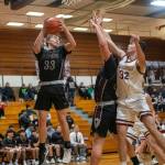 PHOTO BY FOREST WORGUM Raymond-South Bends Tanner Morris (33) gains possession while Montesanos Nathan Dowler (32) defends during the Ravens 57-40 loss to Montesano on Monday at Montesano High School.