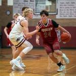 PHOTO BY FOREST WORGUM Hoquiam guard Lincoln Niemi (24) is defended by Montesano forward Mason Fry during the Bulldogs 54-45 victory on Wednesday at Montesano High School.