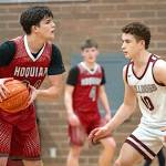 PHOTO BY FOREST WORGUM Hoquiam guard Lincoln Niemi (left) is defended by Montesano guard Terek Gunter during the Bulldogs 54-45 victory on Wednesday at Montesano High School.