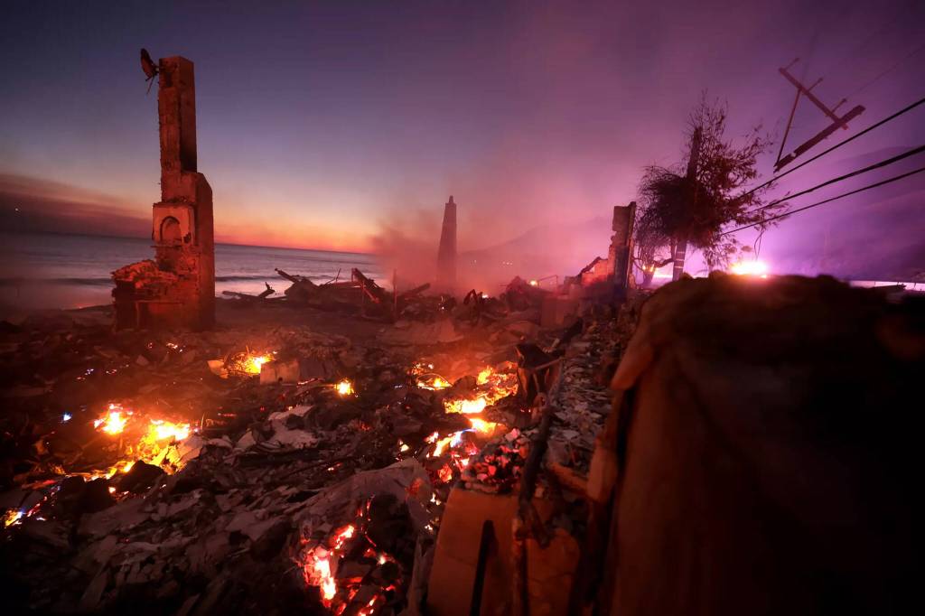 A house burns along PCH as the Palisades Fire burns in Malibu Wednesday, Jan. 8. (Wally Skalij / Los Angeles Times / TNS)