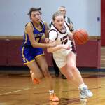 PHOTO BY HAILEY BLANCAS Montesano point guard Tieander Olson (12) dribbles against Rochesters Sadies Dupont during the Bulldogs 62-21 win on Thursday in Montesano.