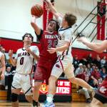 PHOTO BY FOREST WORGUM Hoquiams Lincoln Niemi (24) collides with Teninos Jaxson Gore during the Grizzlies 57-41 loss on Friday at Tenino High School.