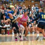 PHOTO BY FOREST WORGUM Hoquiam forward Aaliyah Kennedy (middle) is defended by Aberdeens Delaney Shoemaker (13) and Alyvia Lamont during the Grizzlies 47-42 victory on Monday at Hoquiam Square Garden.