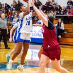 PHOTO BY MIKE ROBERTS Elmas Keke Bol (10) puts up a jump shot while Hoquiams Sydney Gordon defends during the Grizzlies 49-27 win on Tuesday at Elma High School.