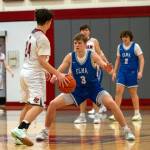 PHOTO BY FOREST WORGUM Elmas Isaac McGaffey (3) defends Hoquiams Lincoln Niemi (24) during the Eagles 56-46 victory on Wednesday in Hoquiam.